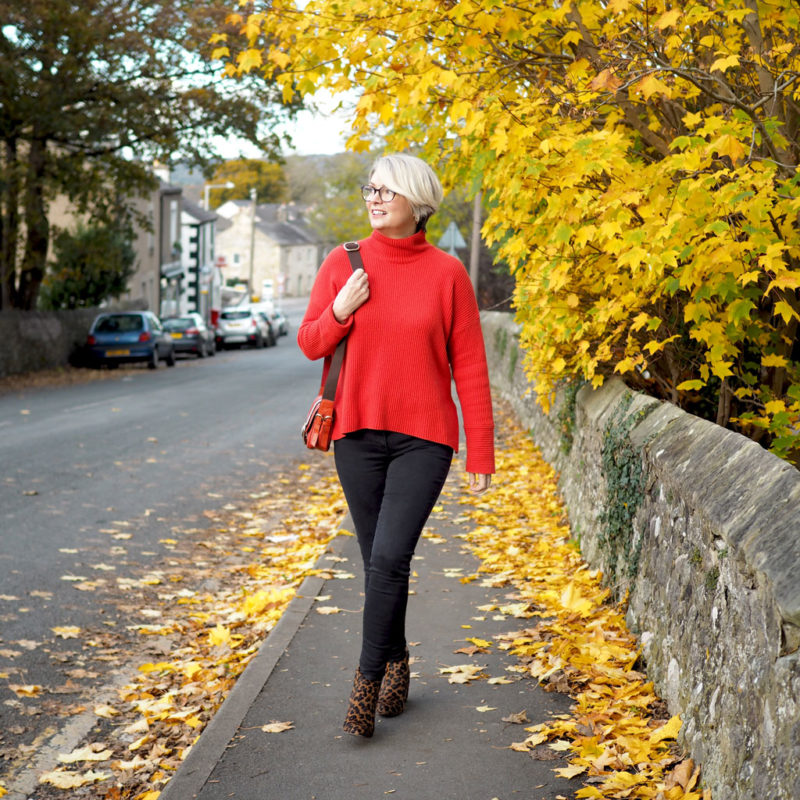 Orange jumper and skinny jeans outfit Midlifechic