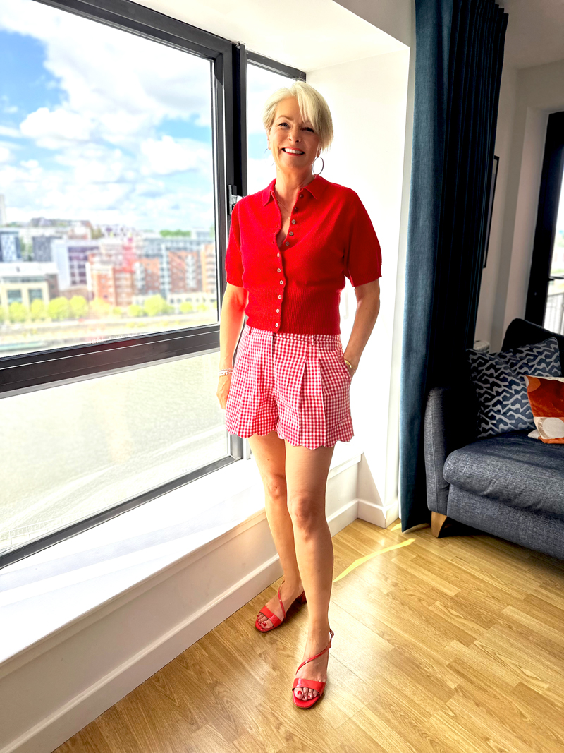 Nikki Garnett wearing Topshop red polo top with gingham scalloped-hem shorts and patent block-heel sandals in midlife